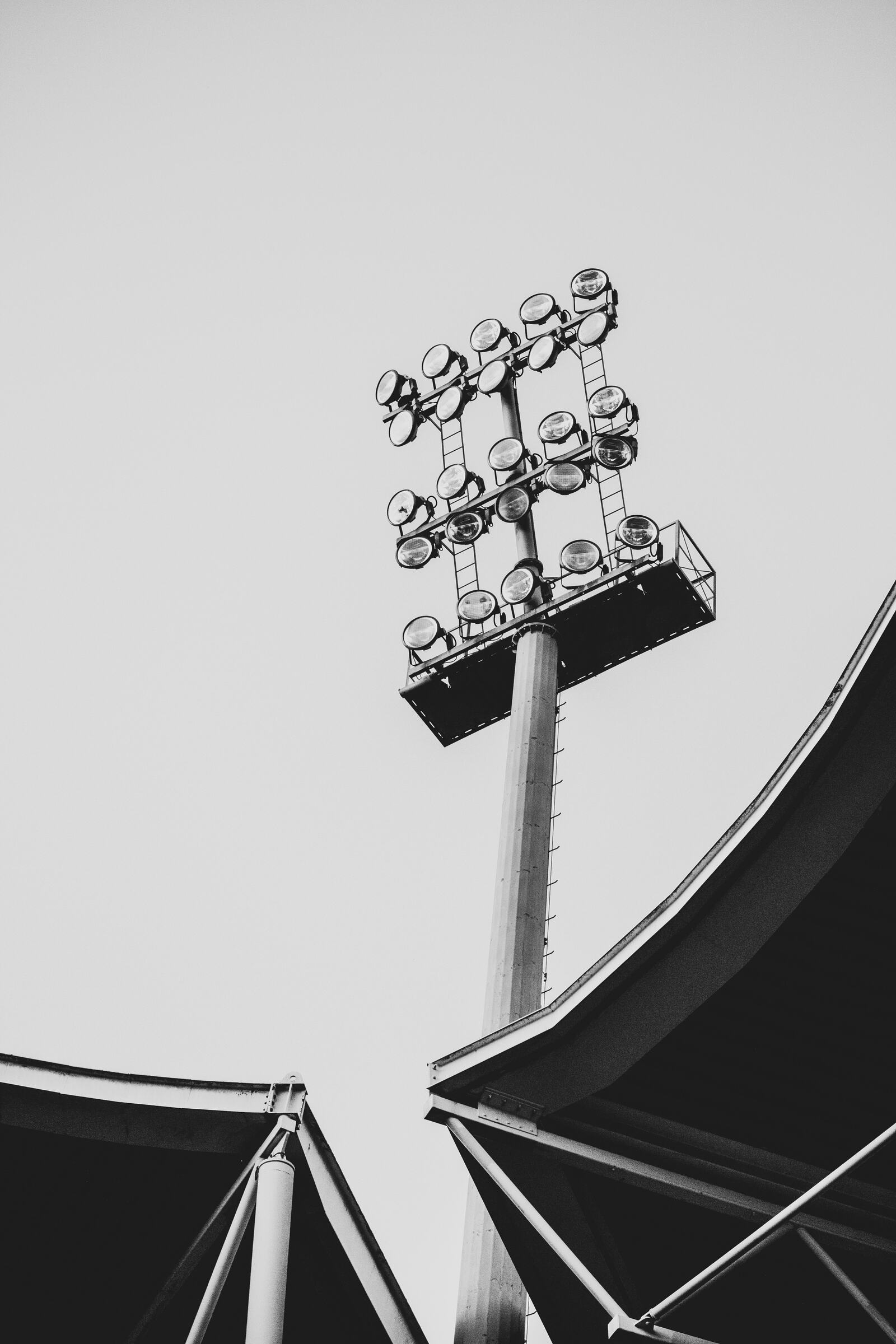 Baseball stadium lights over a packed ballpark at night